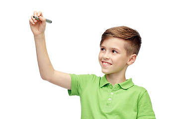 Image showing happy boy in green t-shirt with marker writing