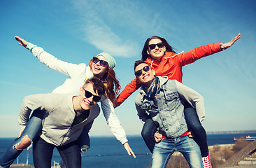 Image showing happy friends in shades having fun outdoors