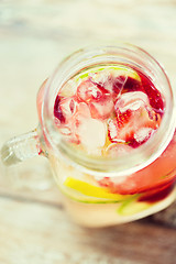 Image showing close up of fruit water in glass bottle