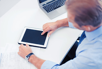 Image showing businessman with tablet pc in office