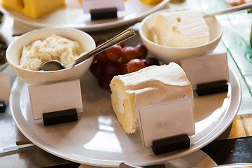 Image showing close up of cheese on showcase at cafe