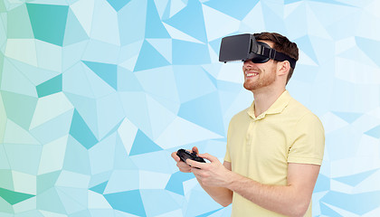 Image showing happy man in virtual reality headset with gamepad