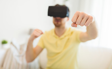 Image showing young man in virtual reality headset or 3d glasses