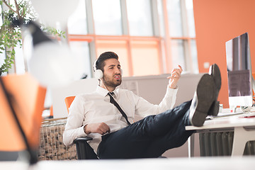 Image showing relaxed young business man at office