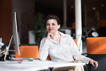 Image showing happy young business woman relaxing and geting insiration