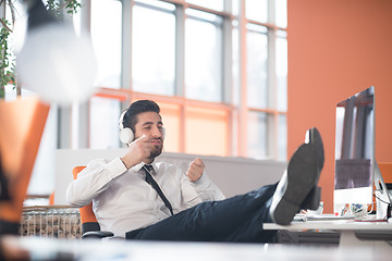 Image showing relaxed young business man at office