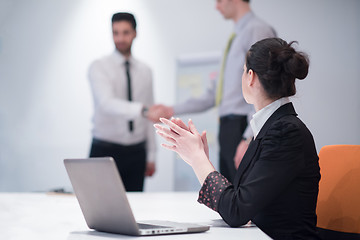 Image showing young business woman on meeting  using laptop computer