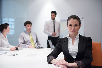 Image showing young business woman on meeting  using laptop computer