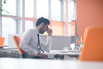 Image showing frustrated young business man at work