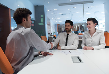 Image showing young couple signing contract documents on partners back