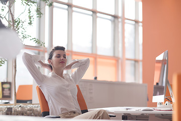 Image showing happy young business woman relaxing and geting insiration