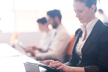 Image showing business woman on meeting  using tablet