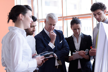 Image showing young startup businessman making presentation to senior investio