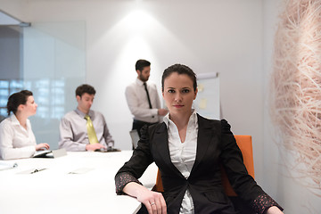 Image showing young business woman on meeting  using laptop computer