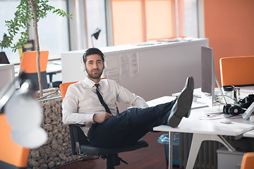 Image showing relaxed young business man at office