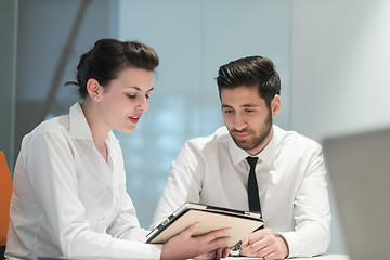 Image showing young business couple working together on project