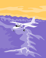 Image showing Airplane flying over mountains