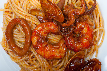 Image showing Italian seafood spaghetti pasta on red tomato sauce 