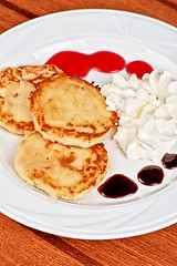 Image showing Cheese pancakes with sour cream 