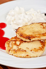 Image showing Cheese pancakes with sour cream 