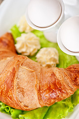 Image showing breakfast from eggs and croissant