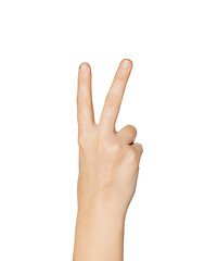 Image showing close up of hand showing peace or victory sign