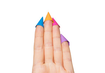 Image showing close up of hand with four fingers in party hats