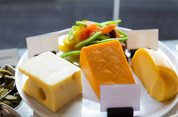 Image showing close up of cheese on showcase at cafe