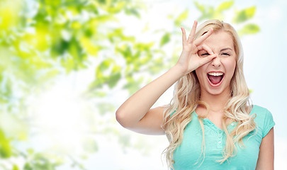 Image showing young woman making ok hand gesture