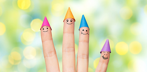 Image showing close up of hand with four fingers in party hats