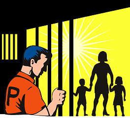 Image showing Prisoner behind bars with family outside