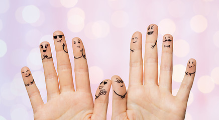 Image showing close up of hands and fingers with smiley faces