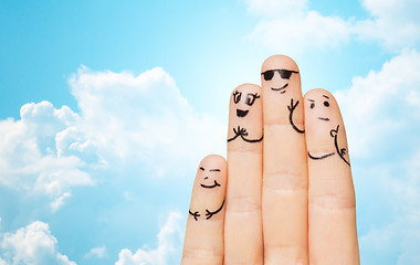 Image showing close up of four fingers family with smiley faces