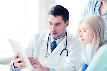 Image showing doctor and nurse with patient in hospital