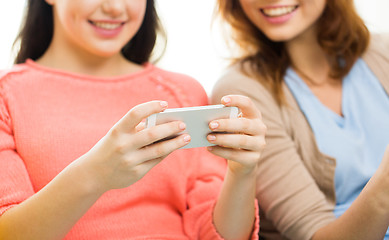 Image showing close up of women or friends with smartphones