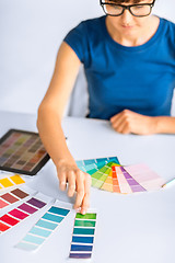 Image showing woman working with color samples for selection