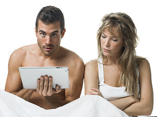 Image showing uncommunicative couple on bed in white 