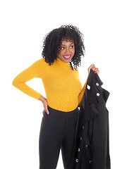 Image showing African American woman in yellow sweater and coat.