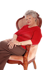 Image showing Relaxed senior woman sitting in armchair.