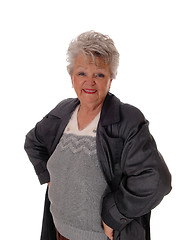 Image showing Senior woman standing in a coat.