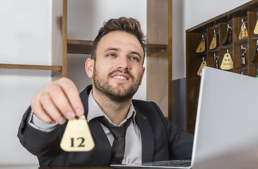 Image showing Receptionist Giving the Key