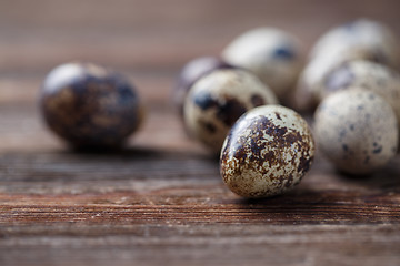 Image showing Group of quail eggs on thewooden background