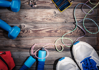 Image showing Sport stuff on wooden table, top view