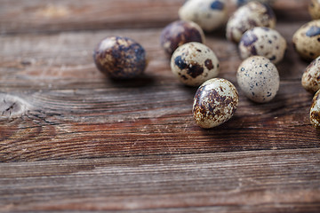 Image showing Group of quail eggs on thewooden background