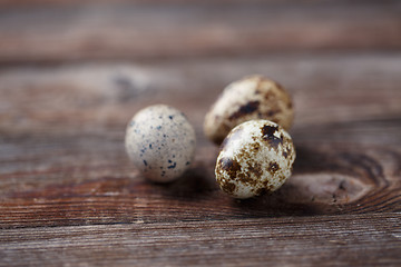 Image showing Group of quail eggs on thewooden background