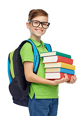 Image showing happy student boy with school bag and books