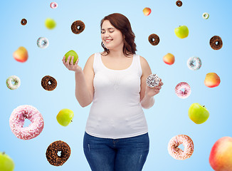 Image showing happy plus size woman choosing apple or donut