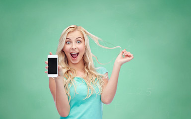 Image showing happy young woman or teenage girl with smartphone