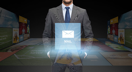 Image showing close up of businessman in suit with email icon