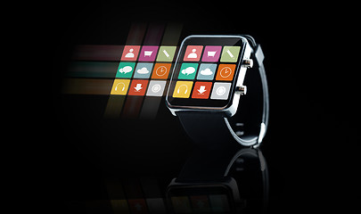 Image showing close up of black smart watch with app icons